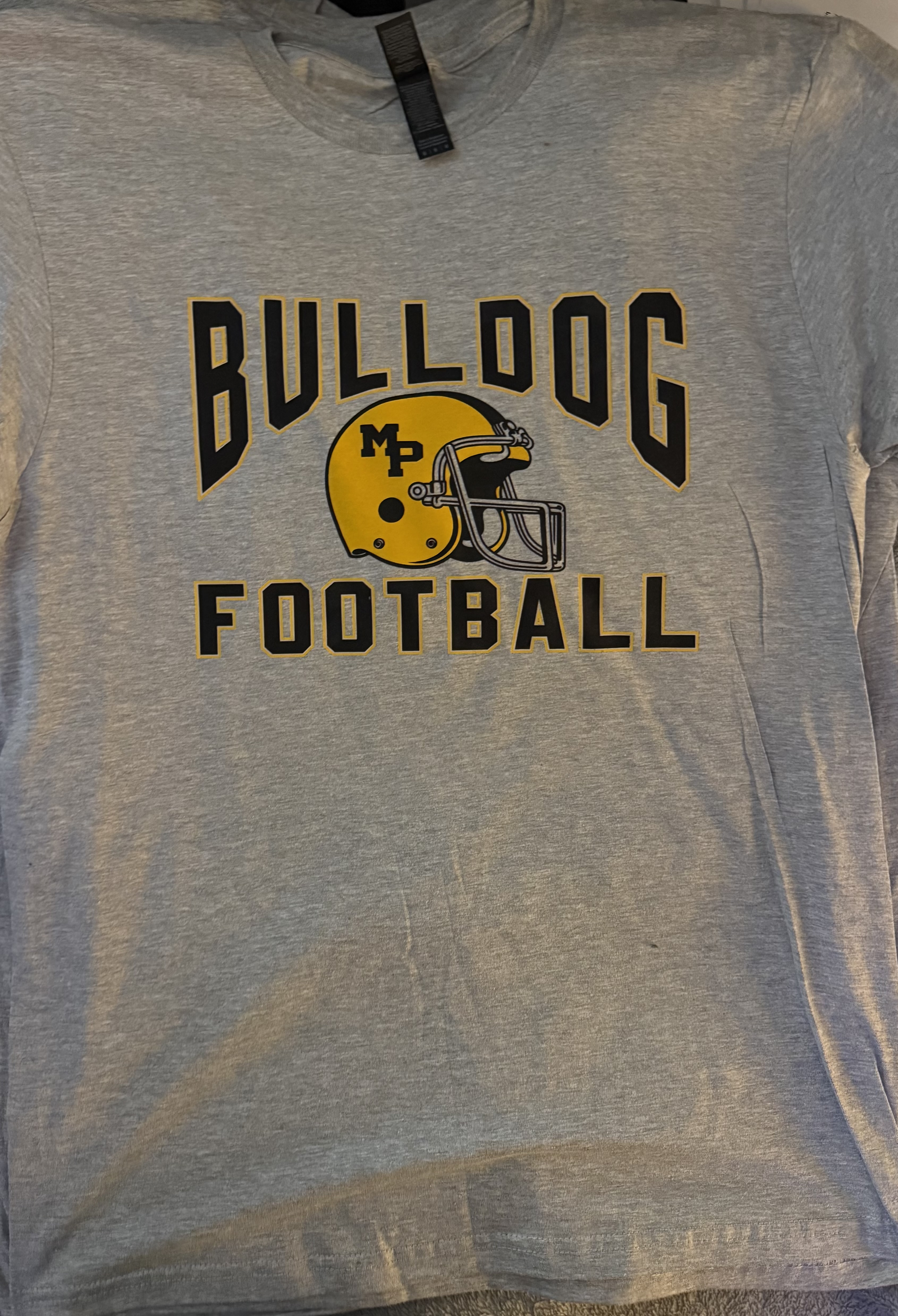 Gray shirt replicated by Crab Apple Orchards Customs with black Bulldog Football lettering and a gold MP helmet.